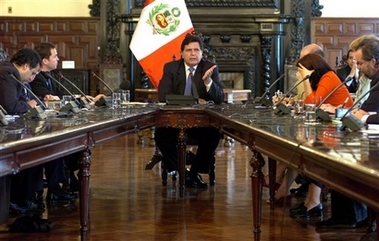 Peru's President Alan Garcia speaks during a press conference with foreign reporters at the presidential palace in Lima, Tuesday, Dec. 19, 2006.